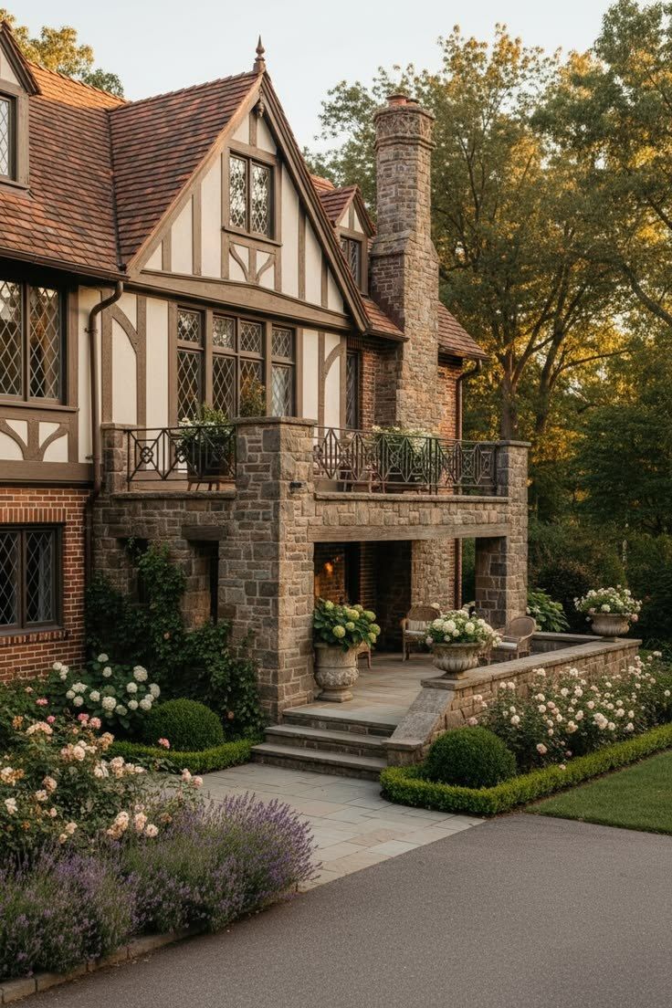 A Tudor house at the end of the day, stone porch, leaded windows, and a tall chimney.